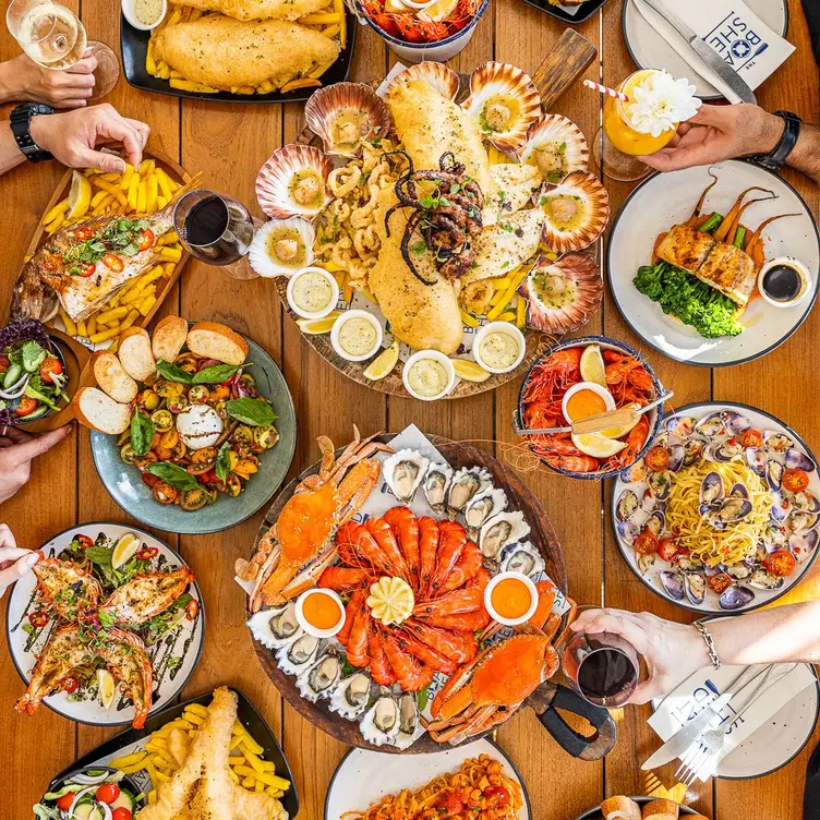 A table filled with a huge range of seafood dishes at The Boatshed La Perouse.