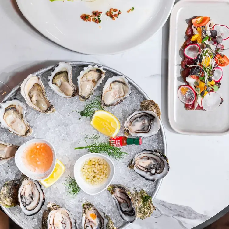 An ice bowl topped with oysters, served at Waterfront Brighton, one of Melbourne’s best seafood restaurants.