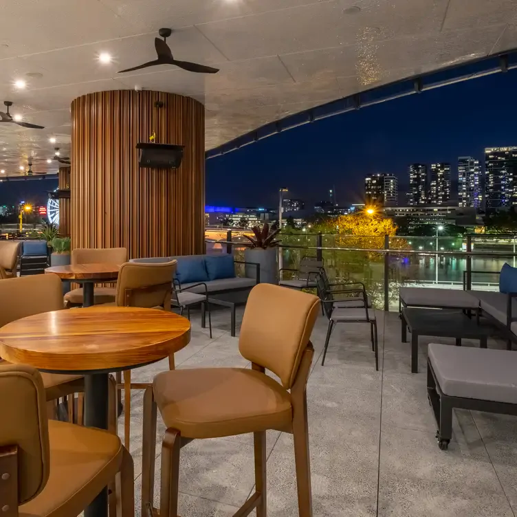 The outdoor dining area and Brisbane City views at Persone Italian Restaurant in Brisbane.