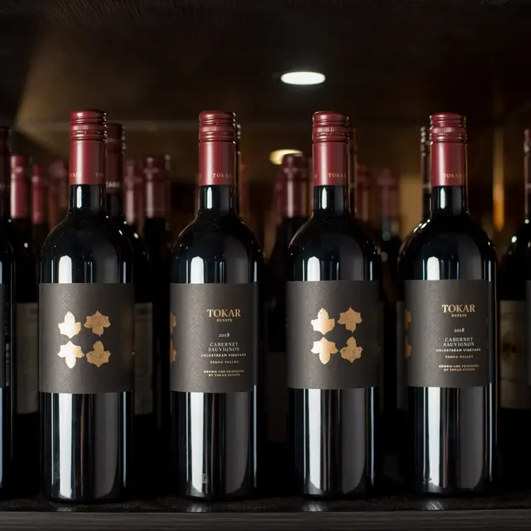 Bottles of Cabernet Sauvignon lined up at Tokar Estate, one of the best wineries in Victoria.