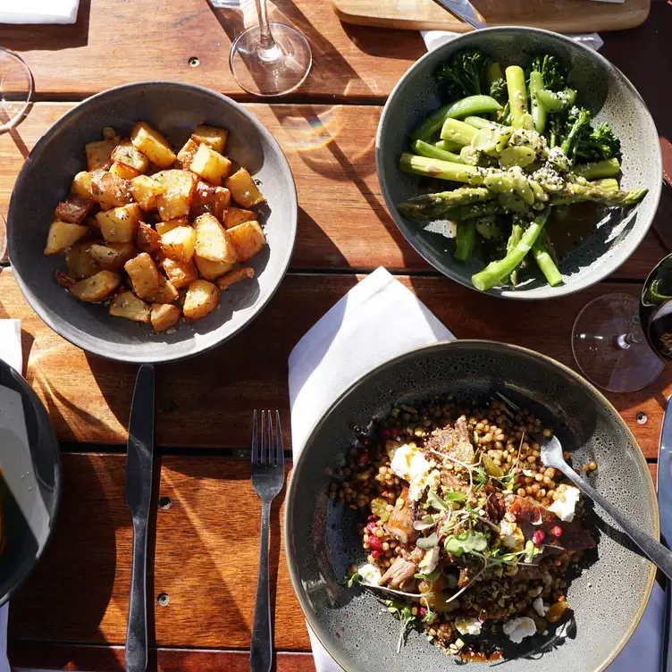 Bowls of vegetables and a grain-based dish served at Immerse Yarra Valley, one of the best winery restaurants in Victoria.