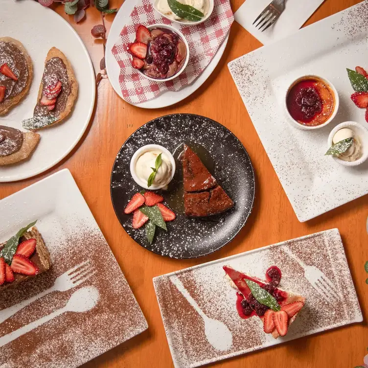 Several desserts, including Nutella pizza, chocolate cake and puddings, served at Farina Pizzeria - Top Ryde, one of the best new restaurants in Sydney.