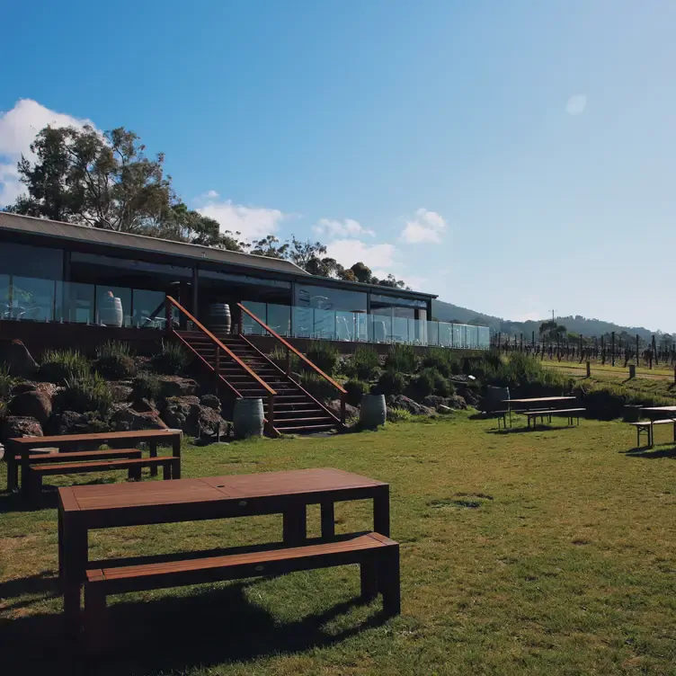 Bench seating outside Greenstone Vineyards’ Cellar Door. A set of stairs leads up to the main building.