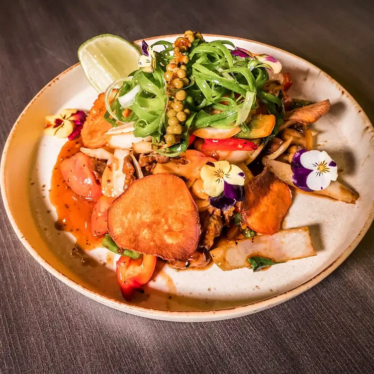 A salad dish decorated with flowers served at District1 Modern Vietnamese Eatery, one of the best Asian restaurants in Adelaide.