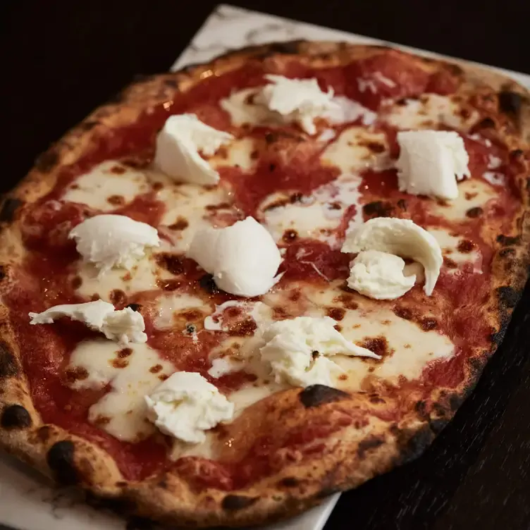 A pizza topped with cured meat and leafy vegetables at Sherwal, one of the best new restaurants in Sydney’s CBD.