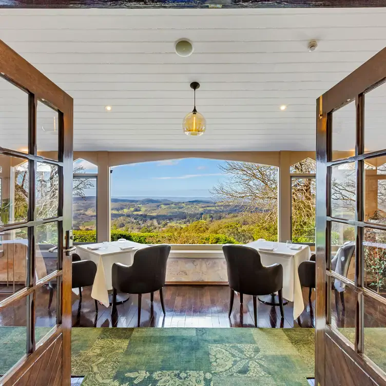 Tables for two, looking out over the view of rolling hills at Hardy’s Verandah Restaurant, one of the best restaurants in South Australia.