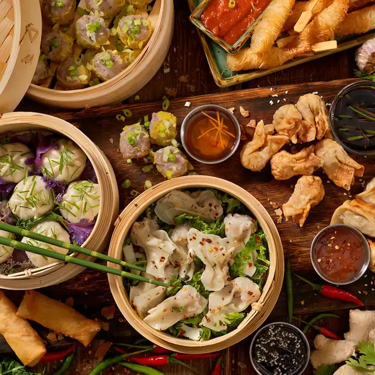 A few steam baskets filled with dumplings served alongside fried dishes at Diner88 Top Ryde, one of Sydney’s best new restaurants.