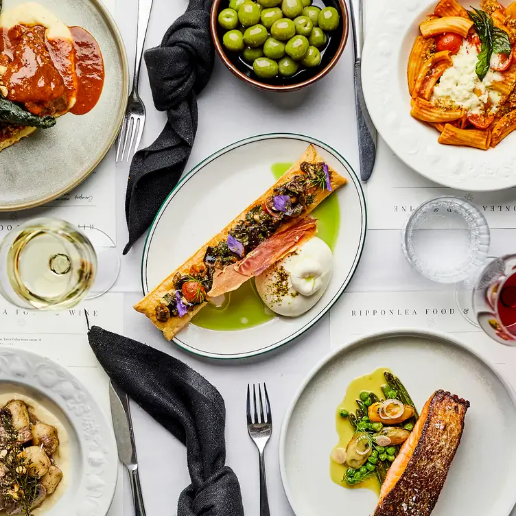 Several dishes including salmon, pasta and olives served at Ripponlea Food & Wine, one of the best new restaurants in Melbourne in 2024.