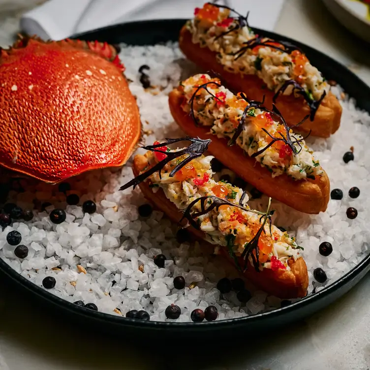 A plate of crab served on a bed of salt at Allegro Restaurant, one of the best new restaurants in Melbourne.