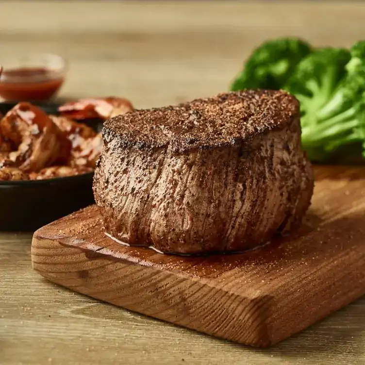 A large steak served at Outback Steakhouse, one of the best family-friendly restaurants in Sydney.