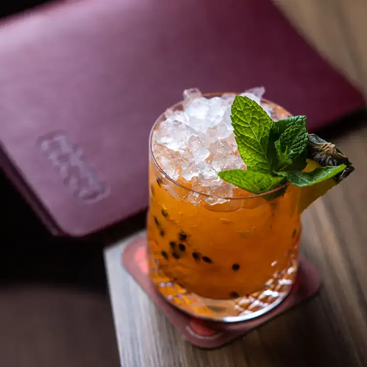 An orange cocktail served at Sasso Italiano, one of the best family restaurants in Brisbane.