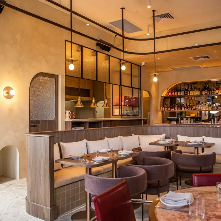 The interior of Sasso Italiano, with couch seating and warm lighting.