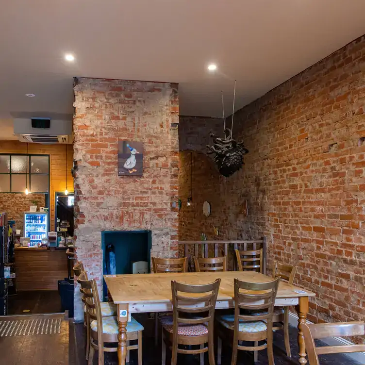 The interior of The Lost Dice, showing its exposed brick walls and unique decorations.