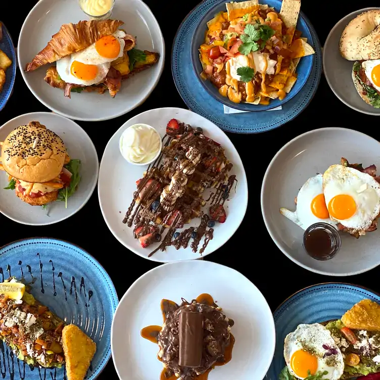 Several dishes, including burgers, croissants and waffles, served at Golly Gosh!, one of the best places for brunch in Brisbane.