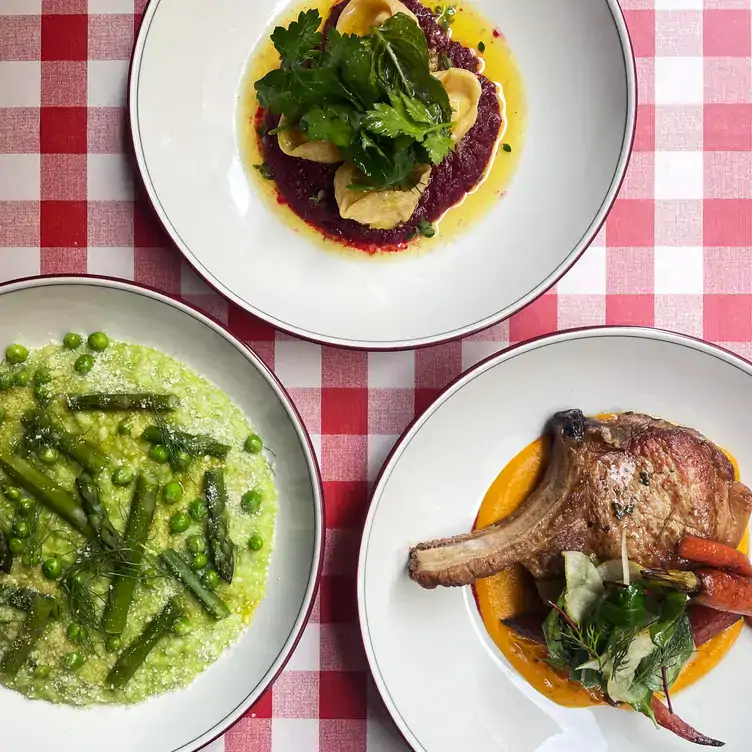 Three dishes, including lamb cutlets, peas and green beans and ravioli, at Railway Hotel.