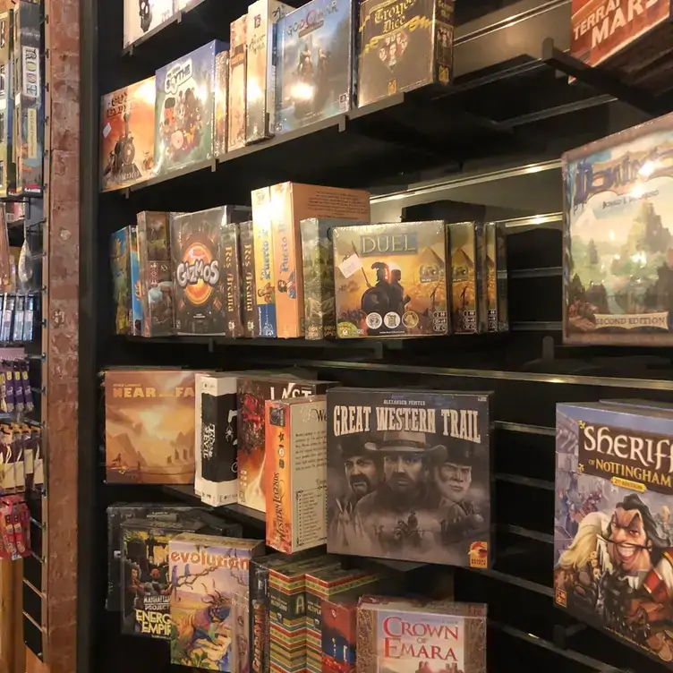 Shelves full of various board games at The Lost Dice, one of the best family restaurants in Adelaide.