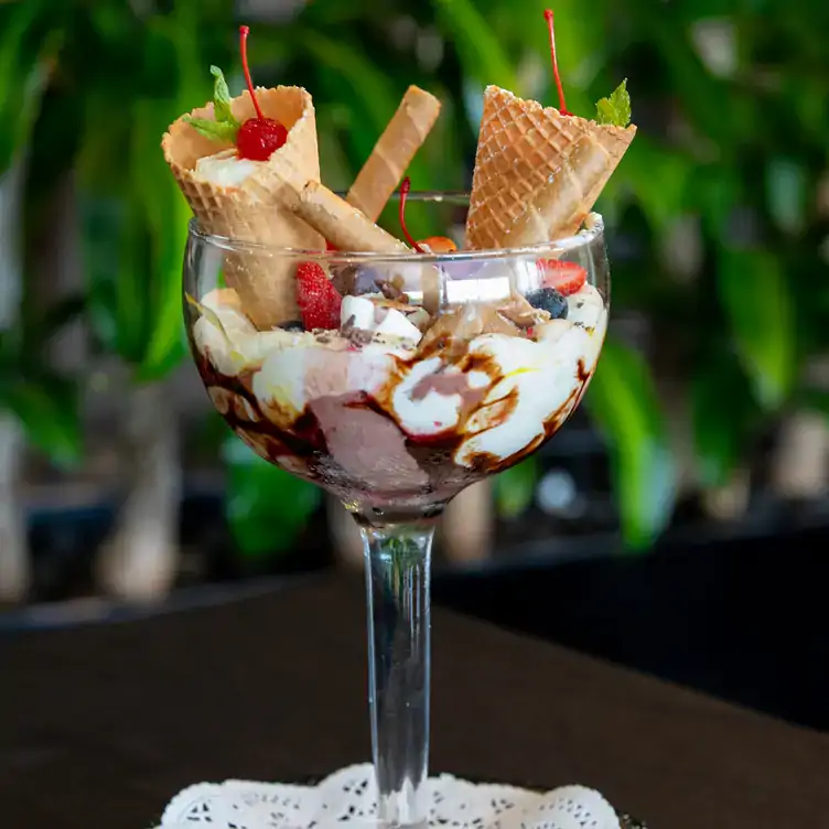 A sundae with chocolate sauce and mini waffle cones served at Sails Restaurant, Redlands RSL, one of the best family restaurants in Brisbane.