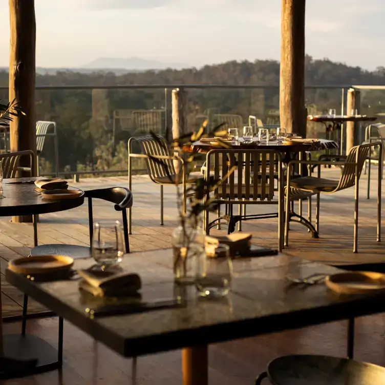 The outdoor dining area of Mimosa Wines, showing the view out over the forest below.