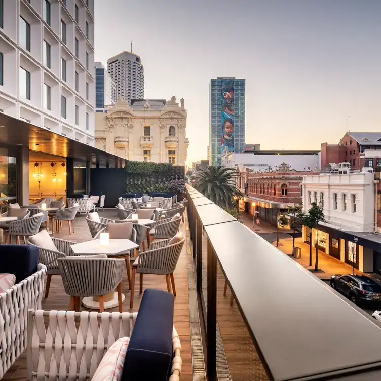 The outdoor terrace at The Loft Lounge and Bar, with a view out over the historic buildings of the CBD.