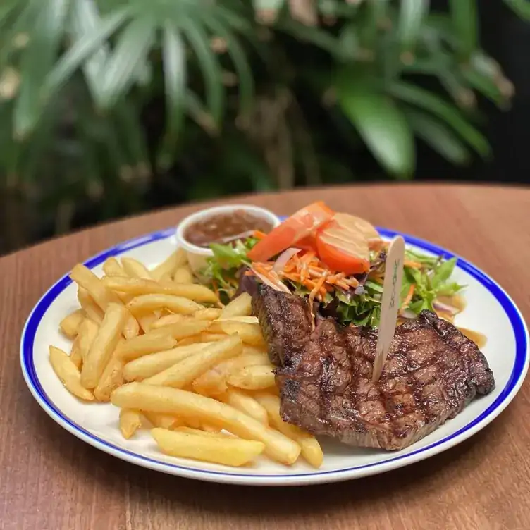 A plate of steak and chips alongside a salad at Criterion Tavern, one of the best pubs in Brisbane.