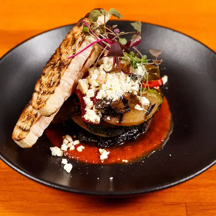 A dish of toast and carefully prepared vegetables served at The Ship Inn, one of the best pubs in Brisbane.