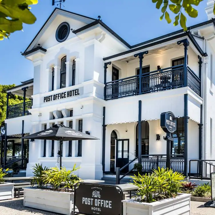 The elegant black and white, two-storey exterior of the Sandgate Post Office Hotel, one of the best pubs in Brisbane.