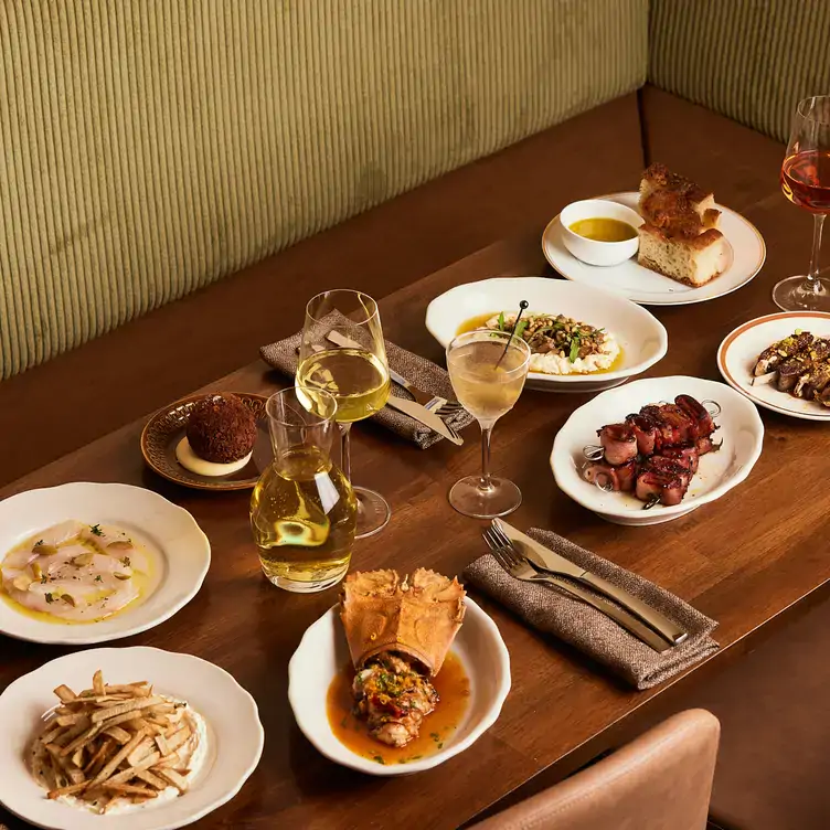 A spread of snack plates and wine at Mr Vincenzo’s