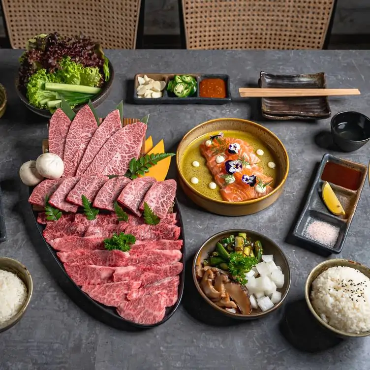 A spread of Japanese dishes featuring a Wagyu platter, seafood and rice at Tajima Yakiniku in Sydney