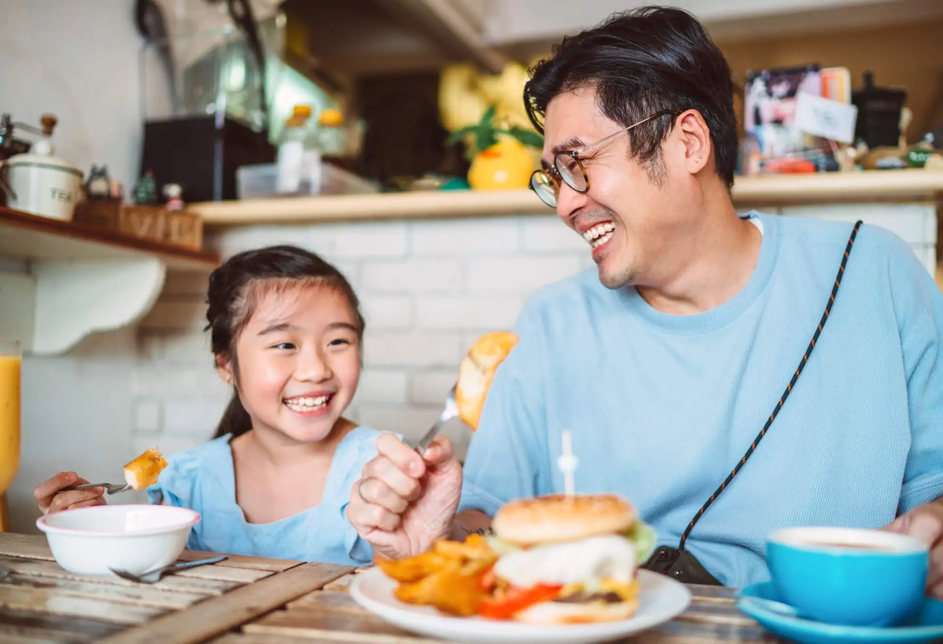 father-and-daughter-eating-a-meal