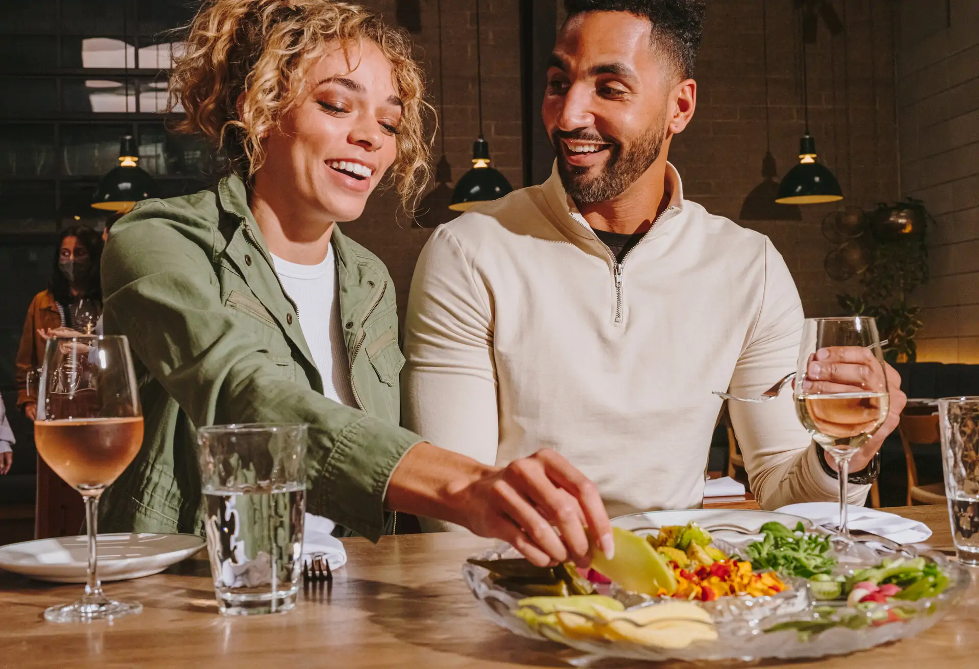 couple-at-a-restaurant-sharing-meal